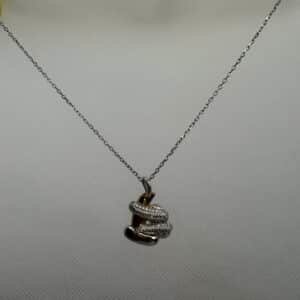 Cadena de plata rodiada en oro blanco con colgante bicolor y circonitas.