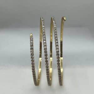 Pulsera chapada en oro amarillo de tres vueltas con circonitas