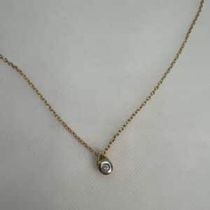 Cadena de oro amarillo y colgante bicolor con brillante. 0.07k.