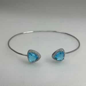 Esclava de plata rodiada en oro blanco con circonitas blancas y azules.