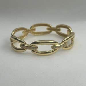 Esclava de plata chapada en oro amarillo eslabones unidos con tira engastada de circonitas.